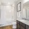 Model bathroom at our apartments in Orlando, featuring granite countertops and a view of the closet. 