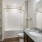 Empty bathroom at our apartments in Avalon Park, FL, featuring white countertops and a combination bath and shower. 