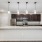 Model kitchen at our apartments in Orlando, featuring wood grain floor paneling and granite counter tops. 