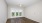 Empty bedroom at our apartments in Orlando, FL, featuring beige carpet and beige walls with overhead lights